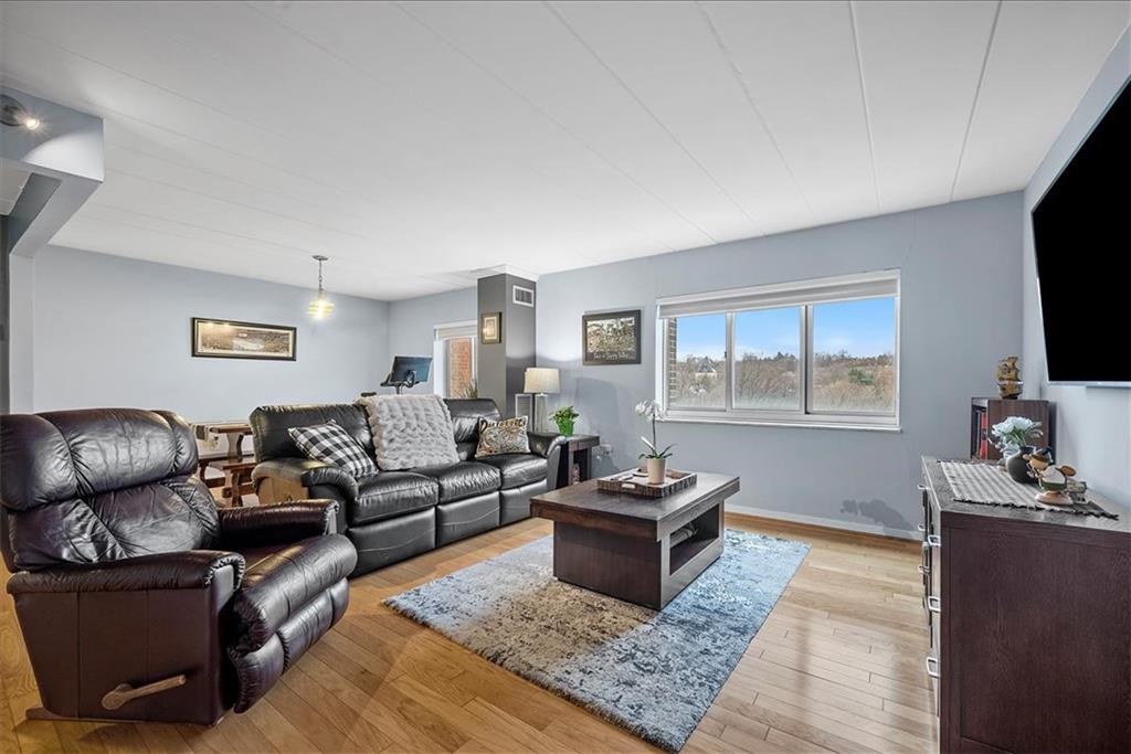 5 Bayard Road, Unit 617 Pittsburgh, PA 15213 - Photo 7 of 15 a living room with furniture and a flat screen tv
