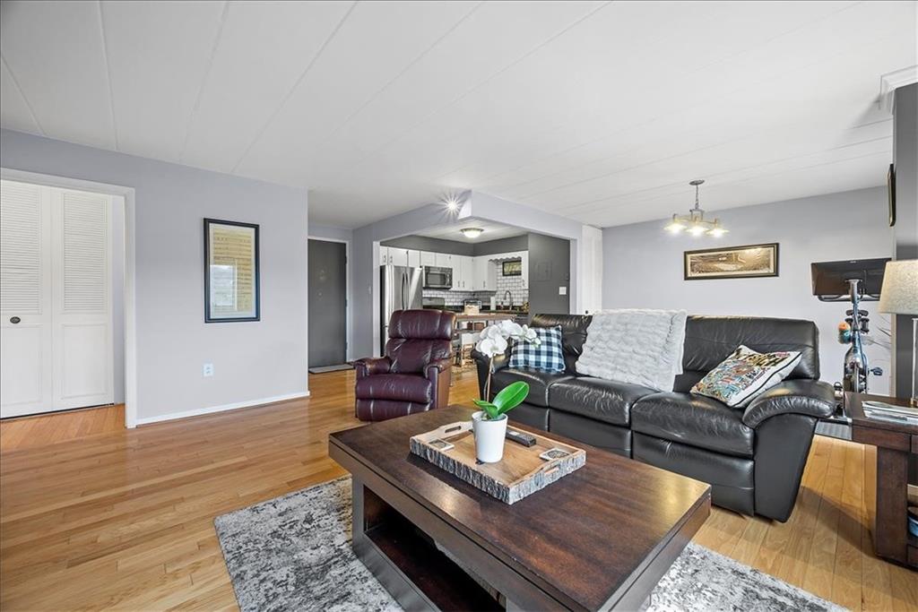 5 Bayard Road, Unit 617 Pittsburgh, PA 15213 - Photo 8 of 15 a living room with furniture and a wooden floor