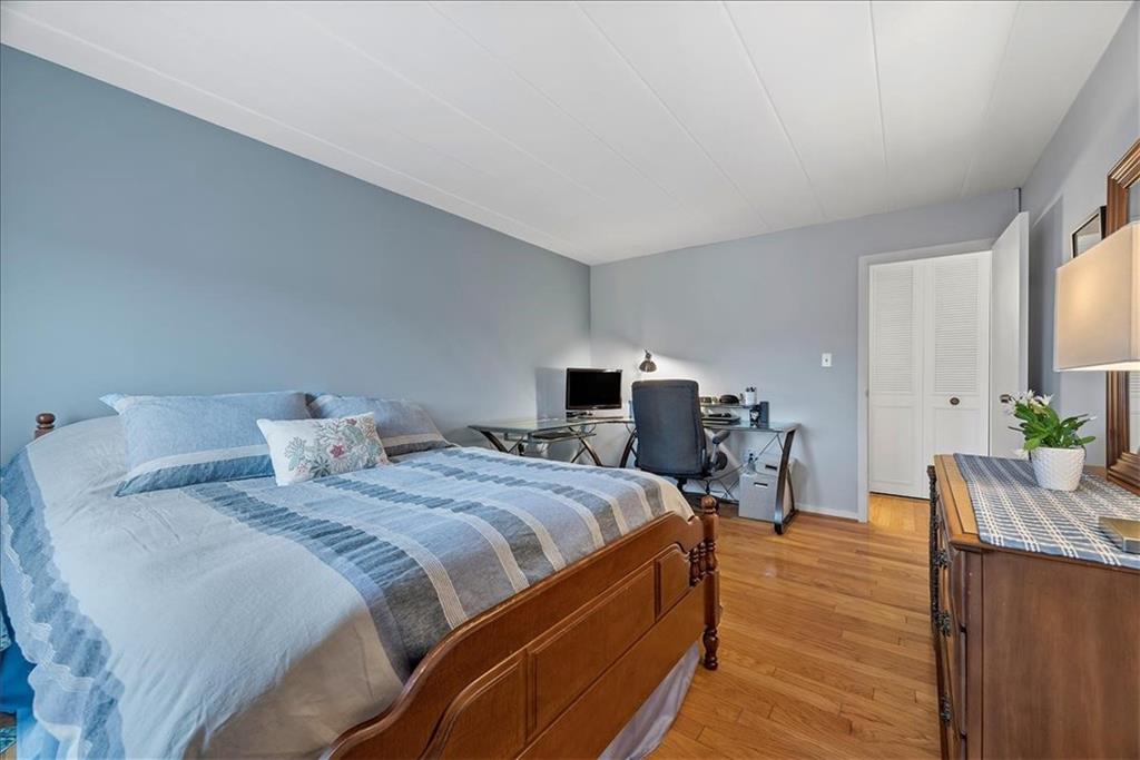 5 Bayard Road, Unit 617 Pittsburgh, PA 15213 - Photo 10 of 15 a bedroom with a bed and wooden floor