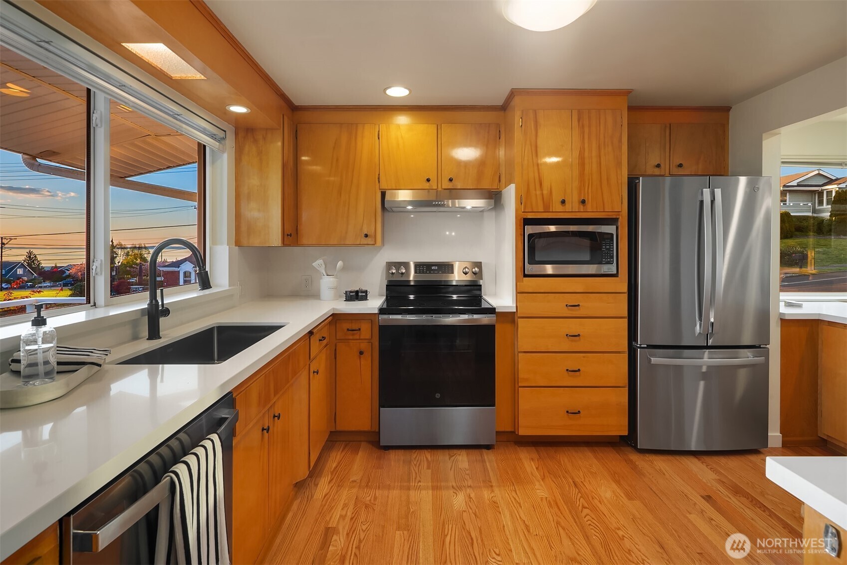 814 Dayton Street Edmonds, WA 98020 - Photo 13 of 36 a kitchen with granite countertop a refrigerator and a stove