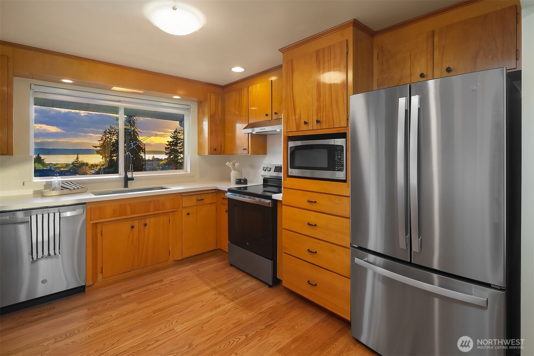 814 Dayton Street Edmonds, WA 98020 - Photo 14 of 36 a kitchen with granite countertop stainless steel appliances a refrigerator stove top oven and sink