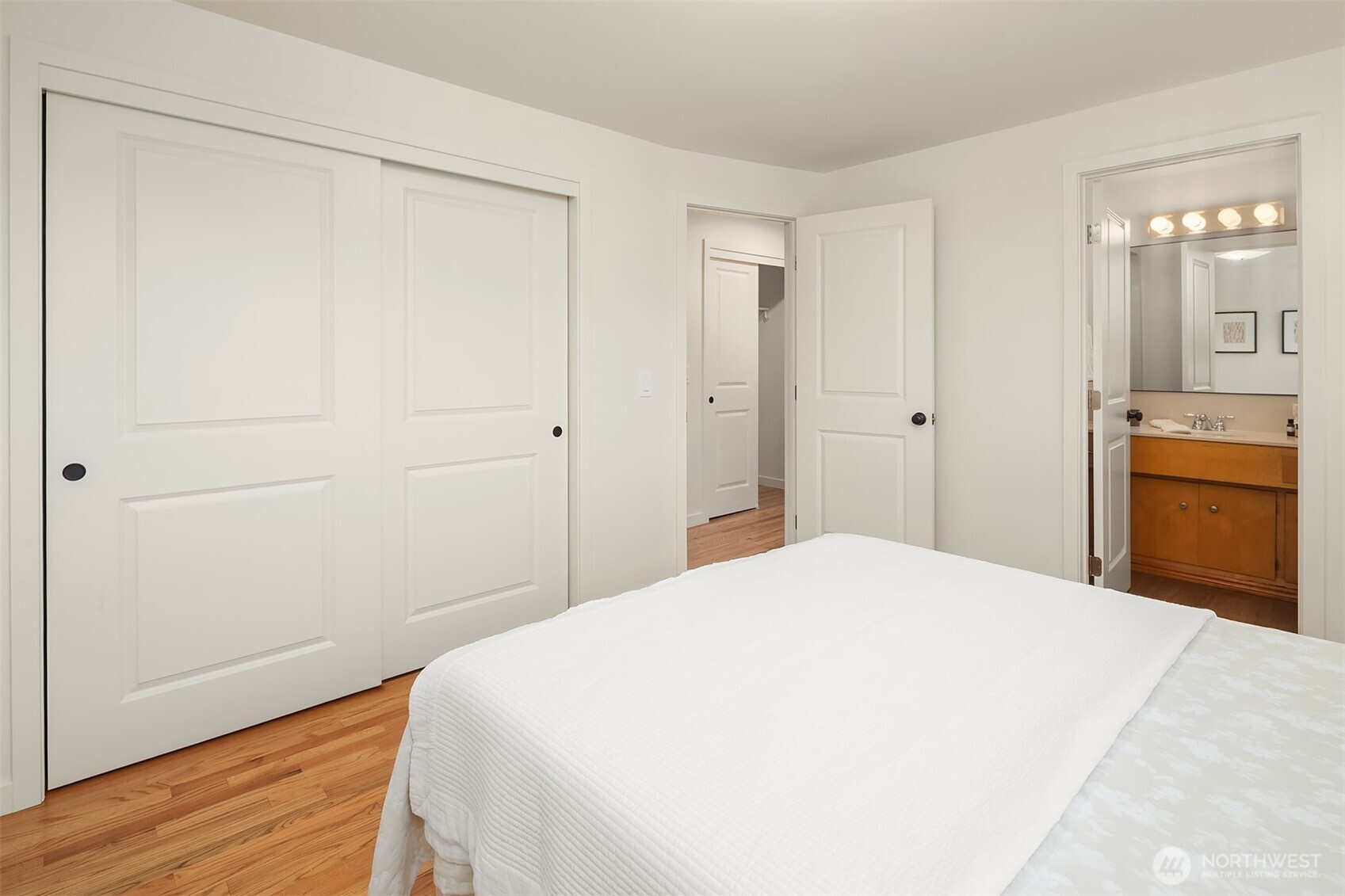 814 Dayton Street Edmonds, WA 98020 - Photo 20 of 36 a bedroom with a bed and a dresser