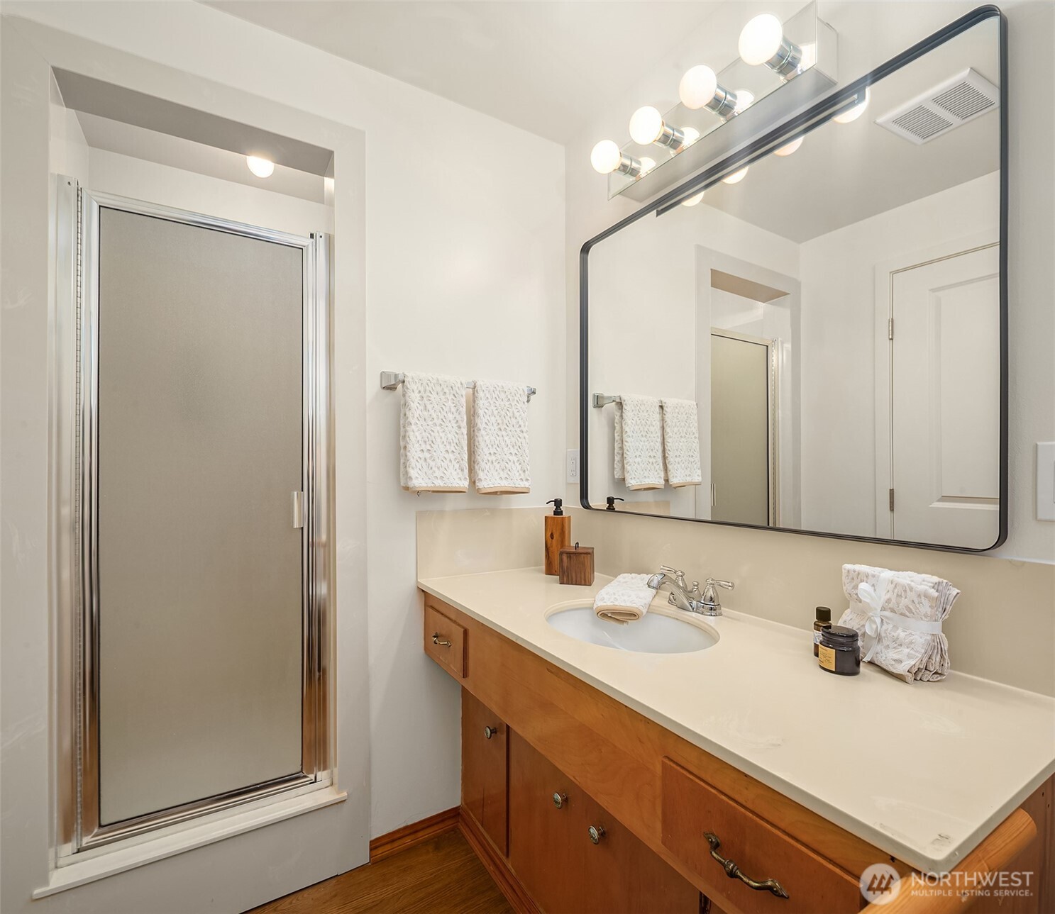 814 Dayton Street Edmonds, WA 98020 - Photo 21 of 36 a bathroom with a sink vanity and a mirror