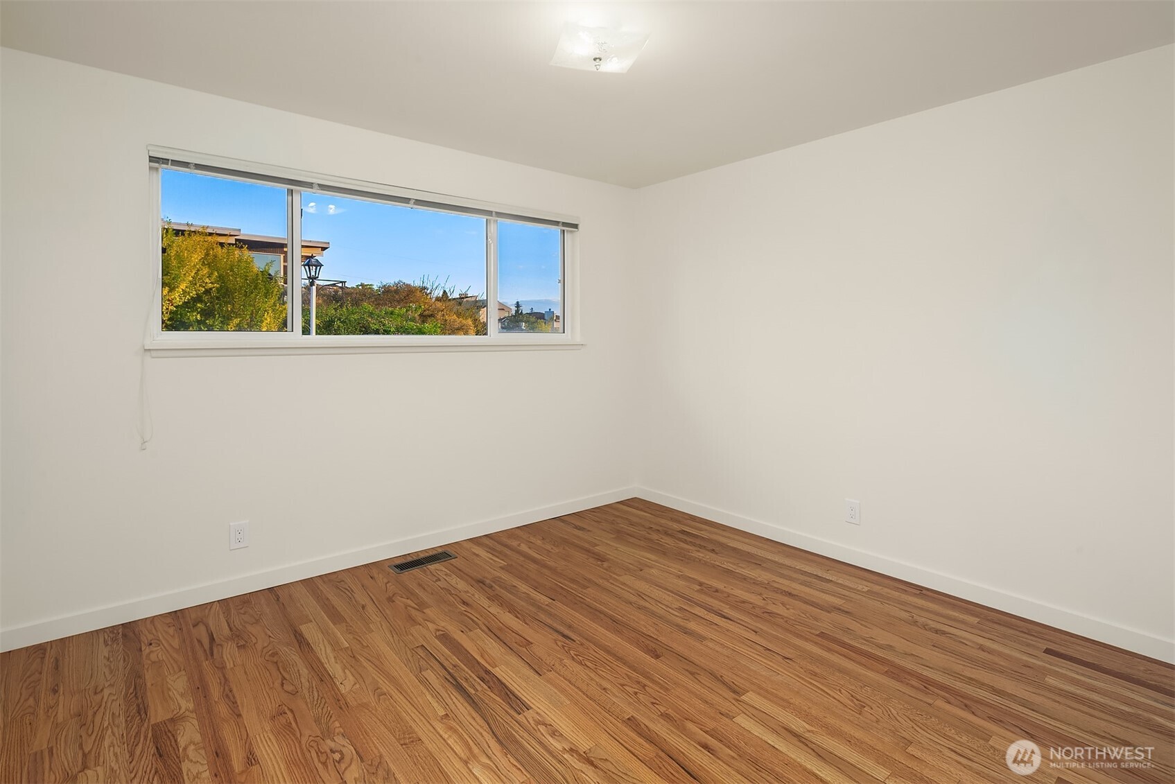 814 Dayton Street Edmonds, WA 98020 - Photo 22 of 36 a view of a room with wooden floor and window