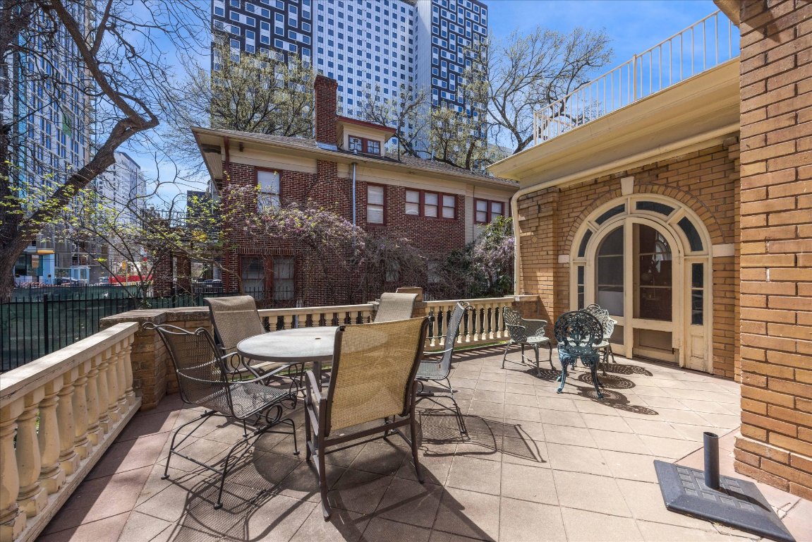 2404 Rio Grande Street Austin, TX 78705 - Photo 22 of 28 a view of a patio with table and chairs and potted plants