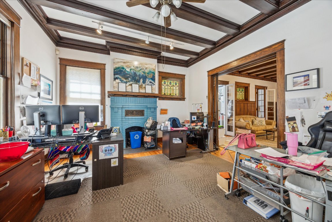 2404 Rio Grande Street Austin, TX 78705 - Photo 4 of 28 a living room with furniture a flat screen tv and a fireplace