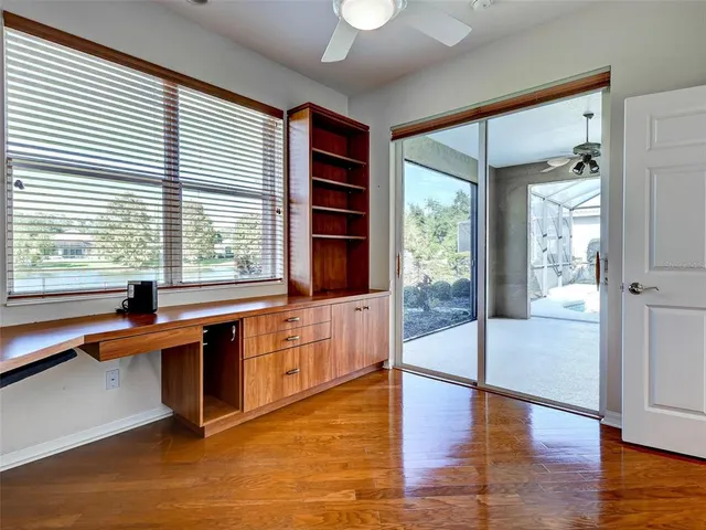 a view of a chairs and table in backyard