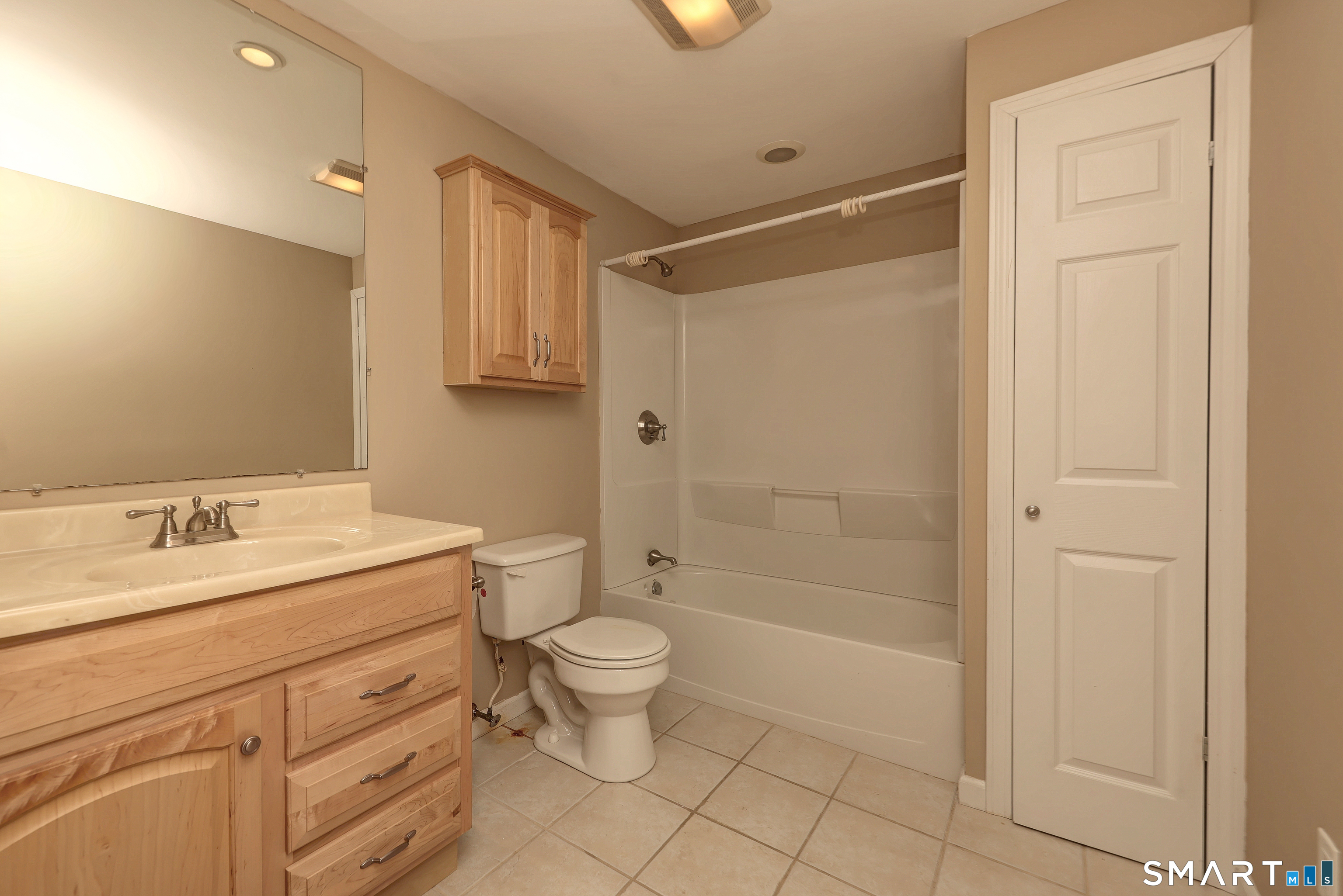 125 Peck Hill Road Woodbridge, CT 06525 - Photo 32 of 40 a bathroom with a granite countertop sink a toilet and shower