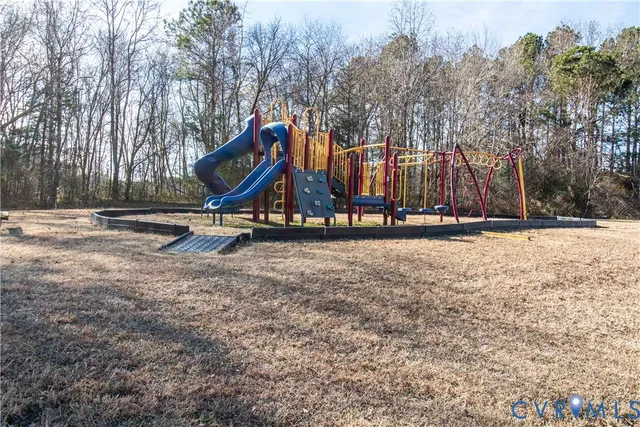 a view of outdoor space with garden and trees