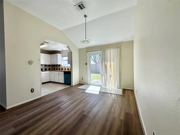 a view of a kitchen with a sink and a stove top oven