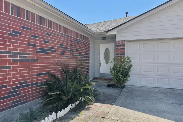 a brick building with a yard
