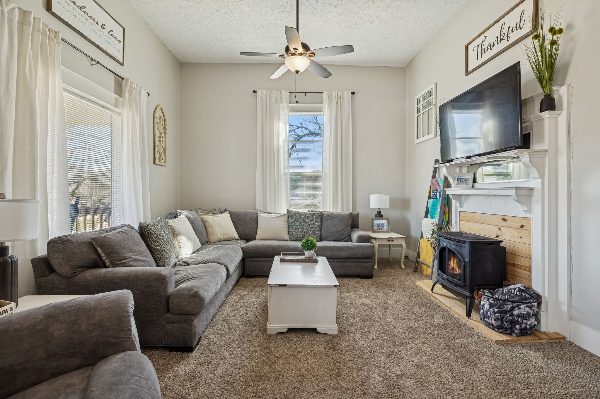 15 Switchboard Road Brush Creek, TN 38547 - Photo 12 of 60 a living room with furniture a flat screen tv and a fireplace