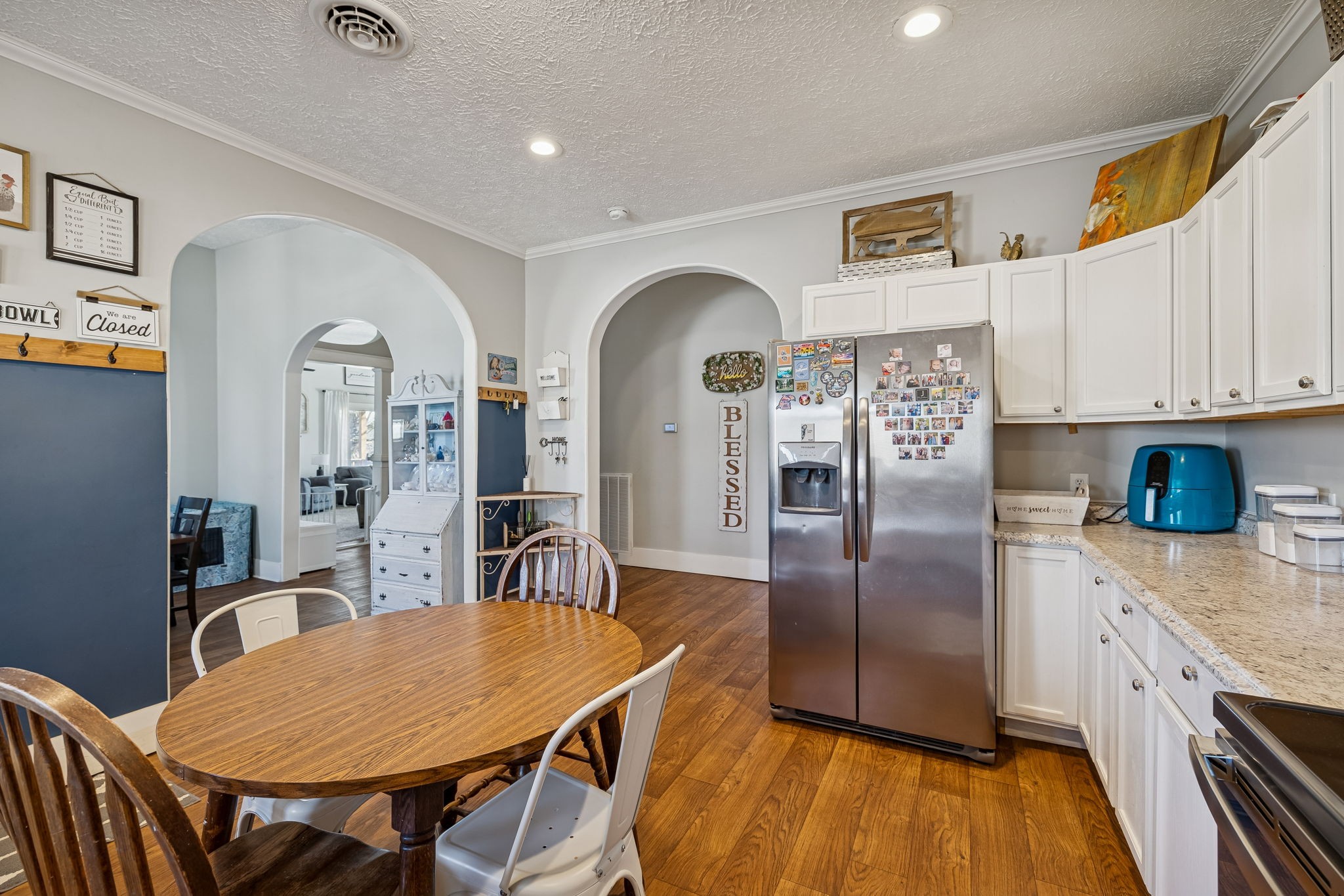 15 Switchboard Road Brush Creek, TN 38547 - Photo 16 of 60 a kitchen with stainless steel appliances granite countertop a kitchen island a stove a table and a refrigerator