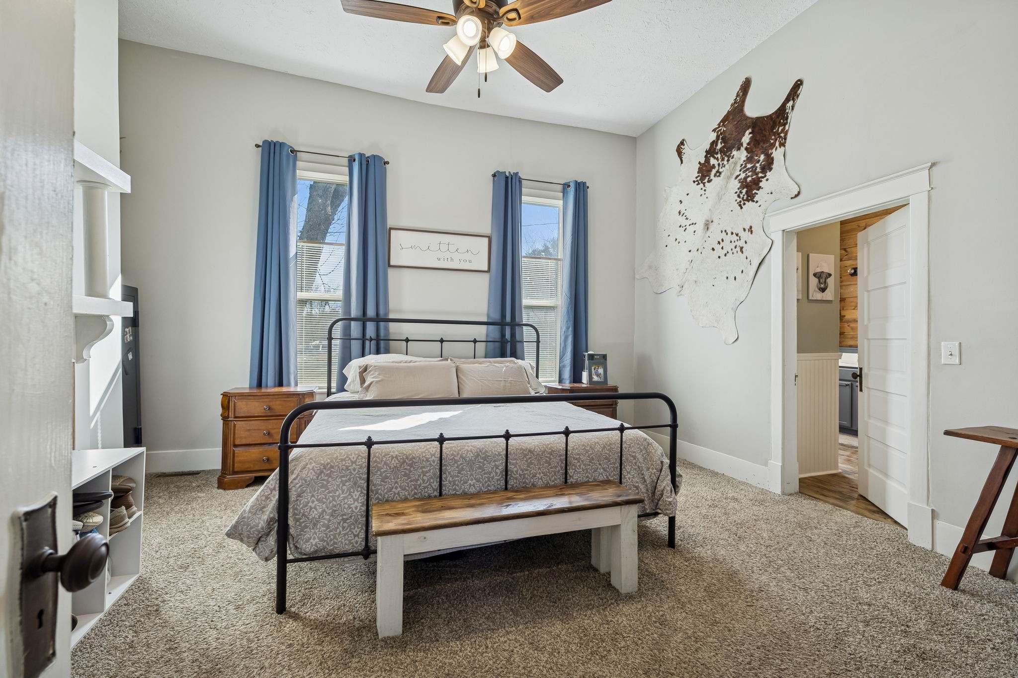 15 Switchboard Road Brush Creek, TN 38547 - Photo 27 of 60 a bedroom with a bed and a chandelier