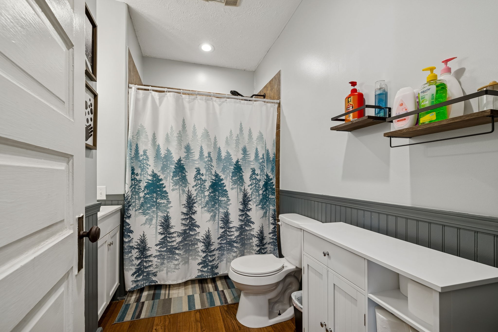 15 Switchboard Road Brush Creek, TN 38547 - Photo 35 of 60 a bathroom with a sink a toilet and shower curtain