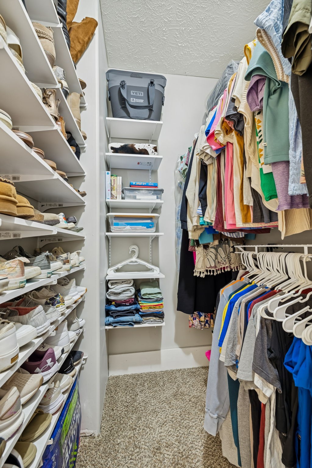 15 Switchboard Road Brush Creek, TN 38547 - Photo 38 of 60 a view of walk in closet with clothes and shoes
