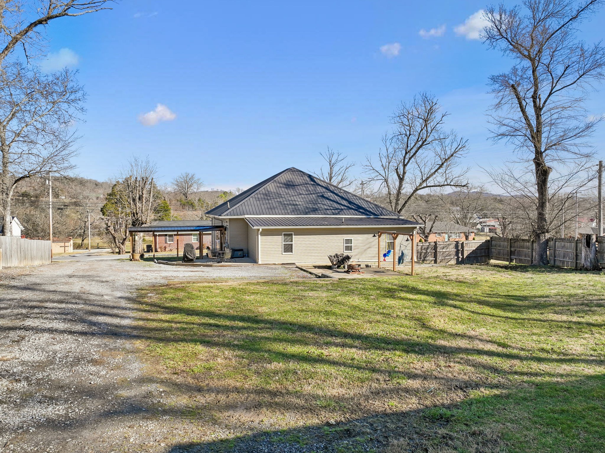 15 Switchboard Road Brush Creek, TN 38547 - Photo 45 of 60 a front view of a house with a garden and trees