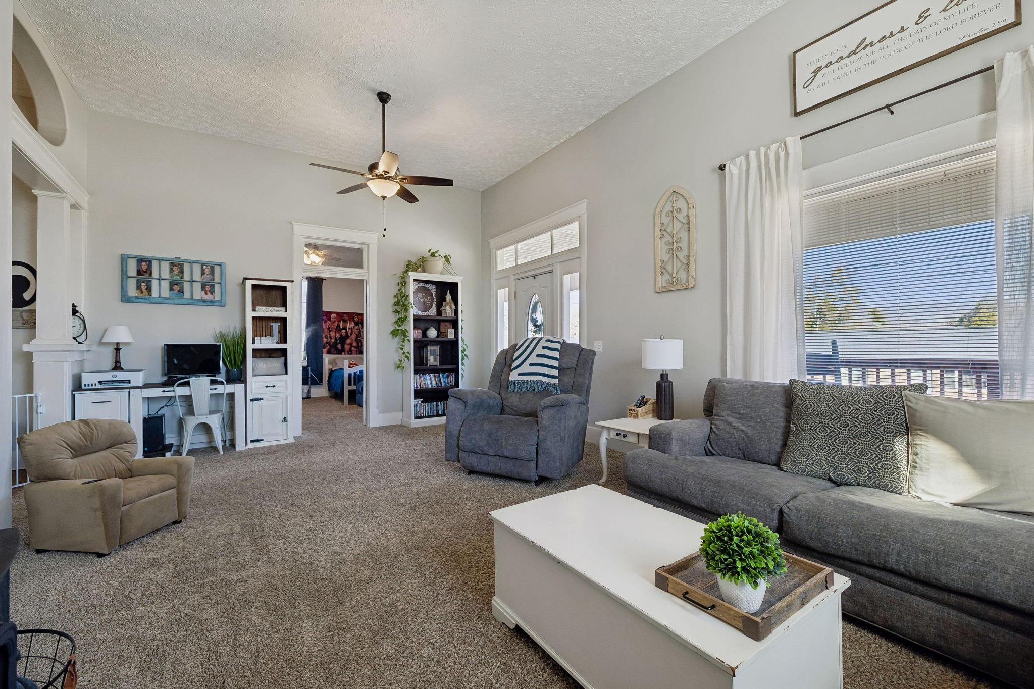15 Switchboard Road Brush Creek, TN 38547 - Photo 10 of 60 a living room with furniture and a chandelier