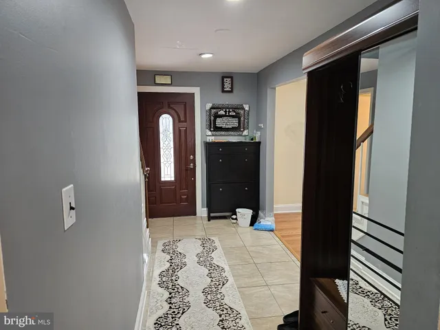 a bathroom with a glass door shower