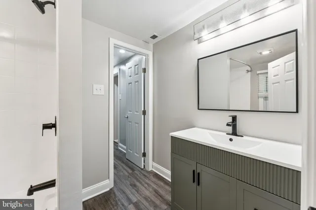 a bathroom with a sink and a mirror