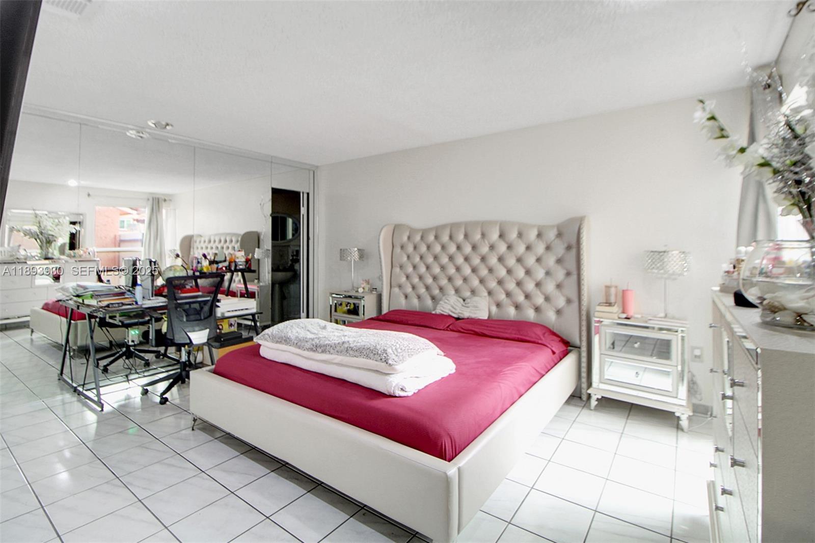 13246 Southwest 9th Terrace Miami, FL 33184 - Photo 11 of 34 a bed room with a bed and a chair