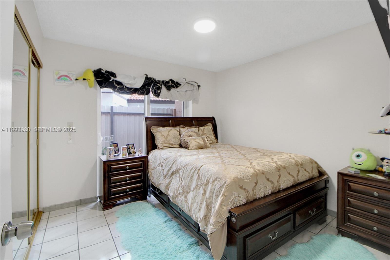 13246 Southwest 9th Terrace Miami, FL 33184 - Photo 15 of 34 a bedroom with a bed and a cabinets