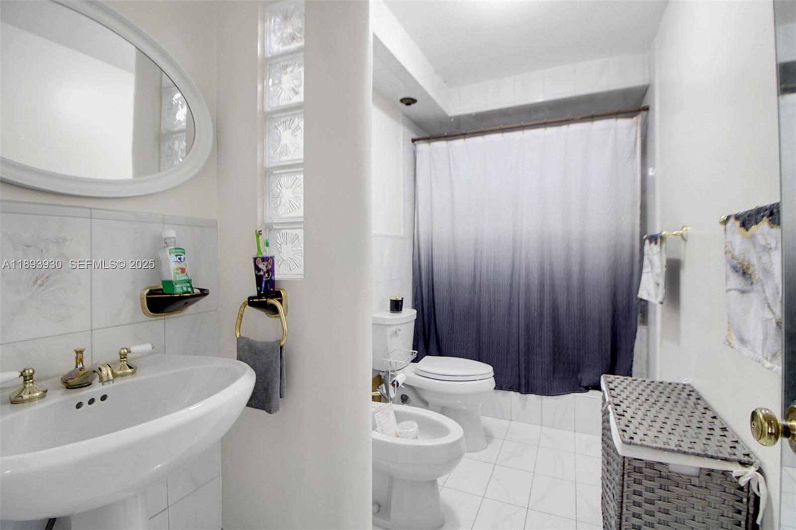 13246 Southwest 9th Terrace Miami, FL 33184 - Photo 16 of 34 a bath room with a sink and a mirror