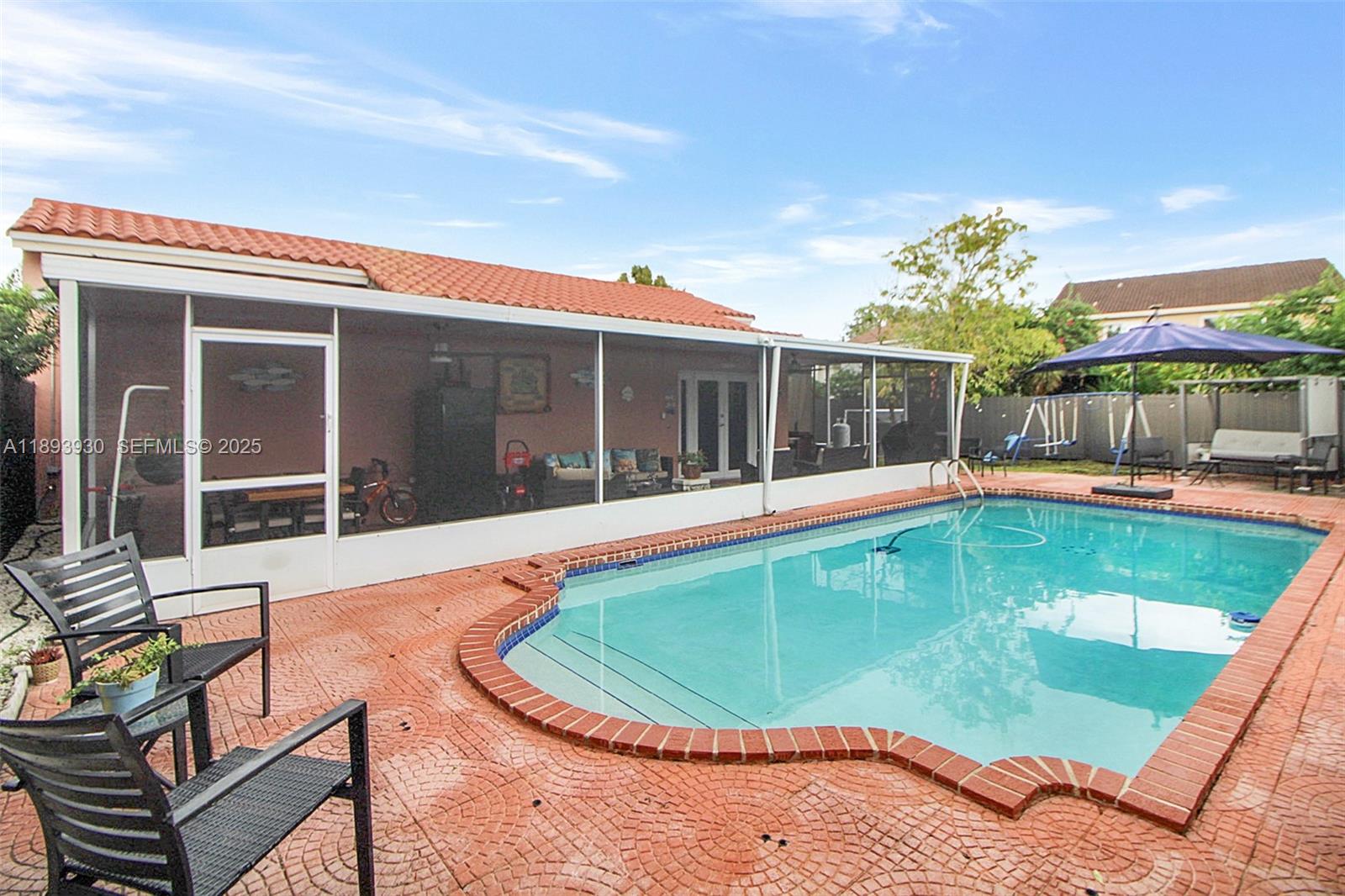 13246 Southwest 9th Terrace Miami, FL 33184 - Photo 2 of 34 swimming pool view with a outdoor space