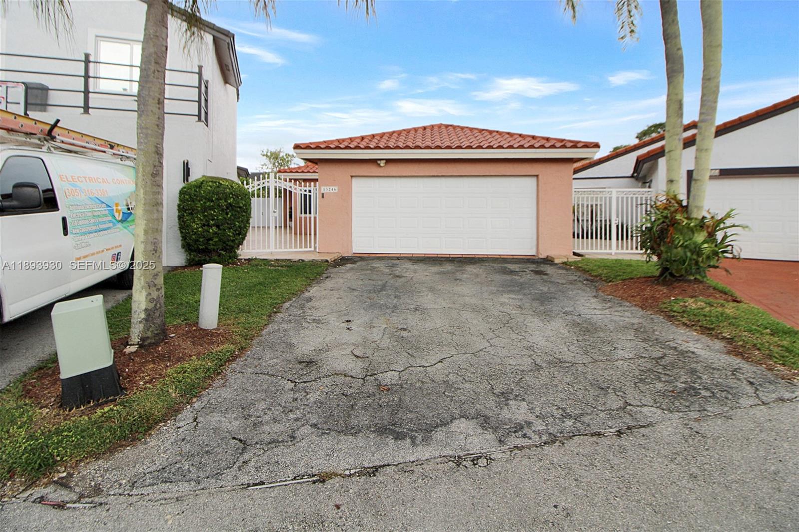 13246 Southwest 9th Terrace Miami, FL 33184 - Photo 25 of 34 a front view of a house with garden