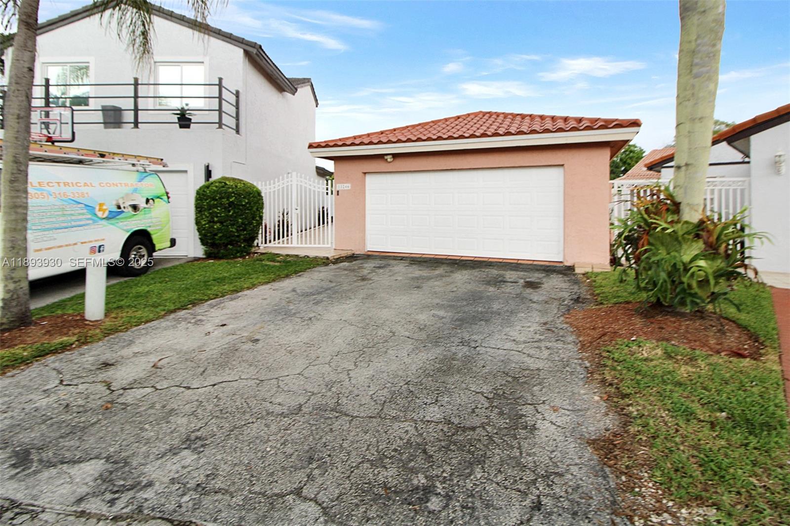 13246 Southwest 9th Terrace Miami, FL 33184 - Photo 26 of 34 a front view of a house with garden