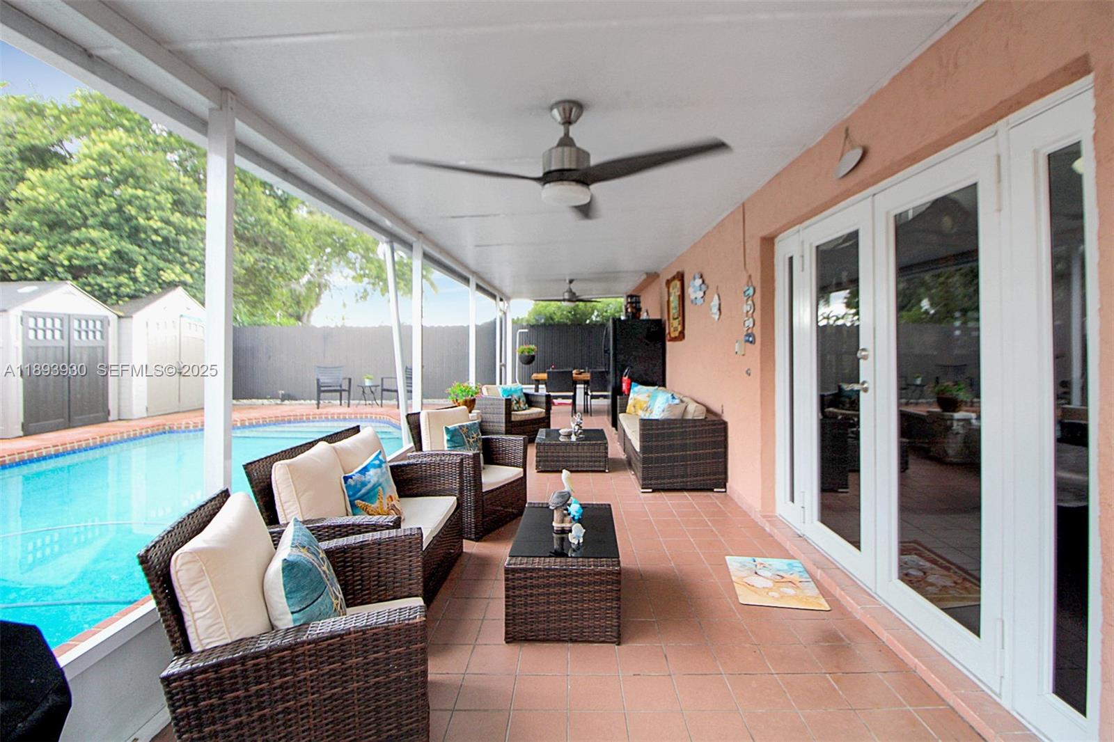 13246 Southwest 9th Terrace Miami, FL 33184 - Photo 3 of 34 a living room with furniture and a large window