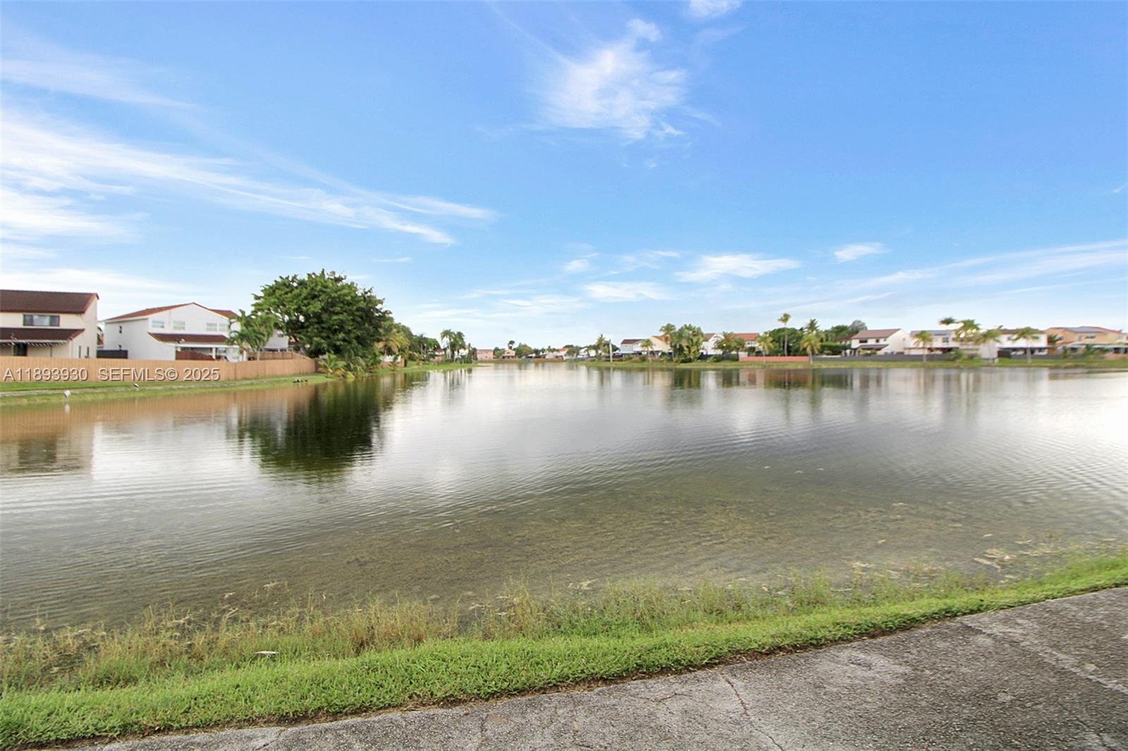 13246 Southwest 9th Terrace Miami, FL 33184 - Photo 31 of 34 a view of a lake with houses in the background
