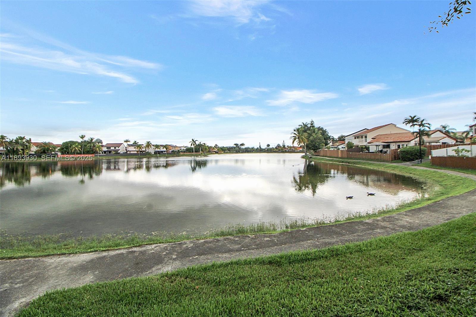 13246 Southwest 9th Terrace Miami, FL 33184 - Photo 34 of 34 a view of a lake with houses in the back