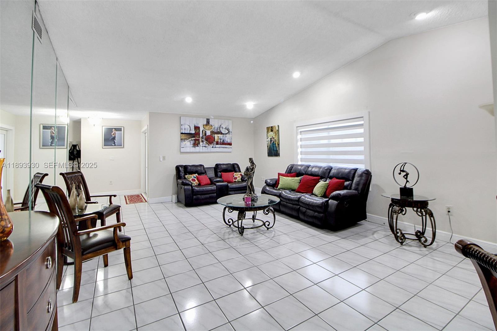 13246 Southwest 9th Terrace Miami, FL 33184 - Photo 6 of 34 a living room with furniture and a window