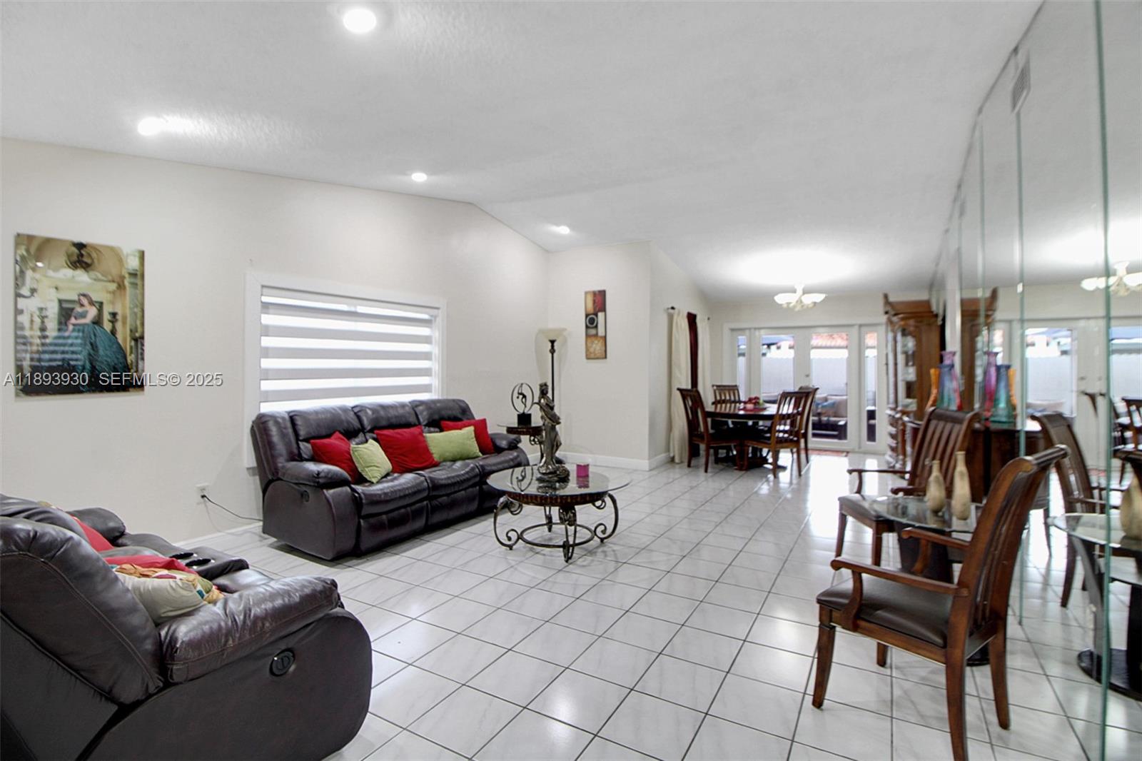 13246 Southwest 9th Terrace Miami, FL 33184 - Photo 7 of 34 a living room with furniture and a dining table with projector kitchen