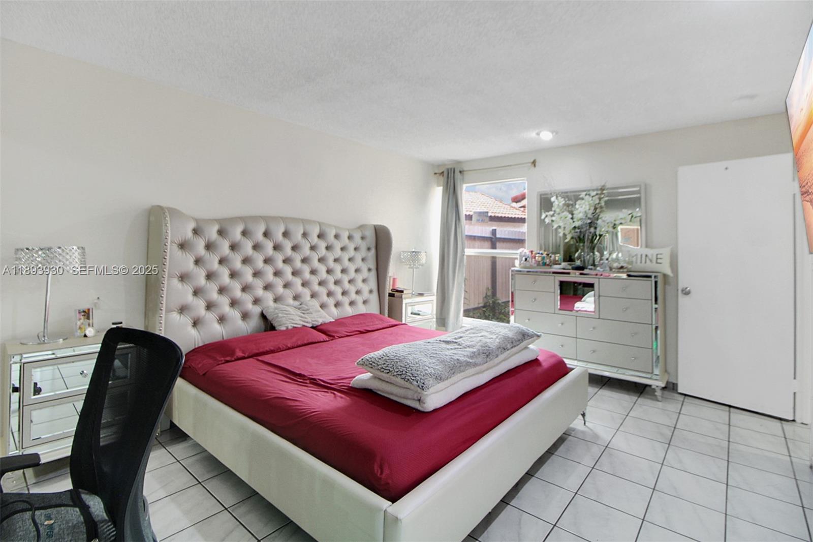 13246 Southwest 9th Terrace Miami, FL 33184 - Photo 10 of 34 a bedroom with a bed and a view of kitchen