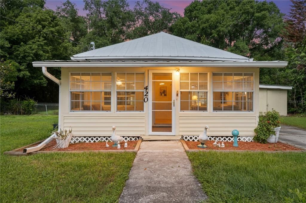 420 Jacks Memorial Road St. Cloud, FL 34769 - Photo 1 of 31 a front view of a house with a yard