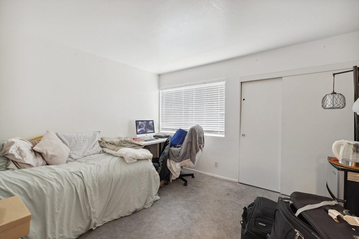 415 West Gutierrez Street, Unit 11 Santa Barbara, CA 93101 - Photo 11 of 16 a bedroom with a bed and a desk