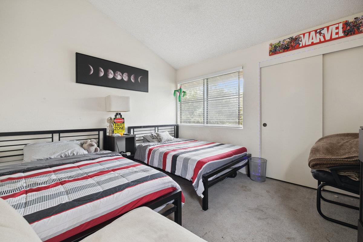 415 West Gutierrez Street, Unit 11 Santa Barbara, CA 93101 - Photo 13 of 16 a bedroom with two beds and a desk
