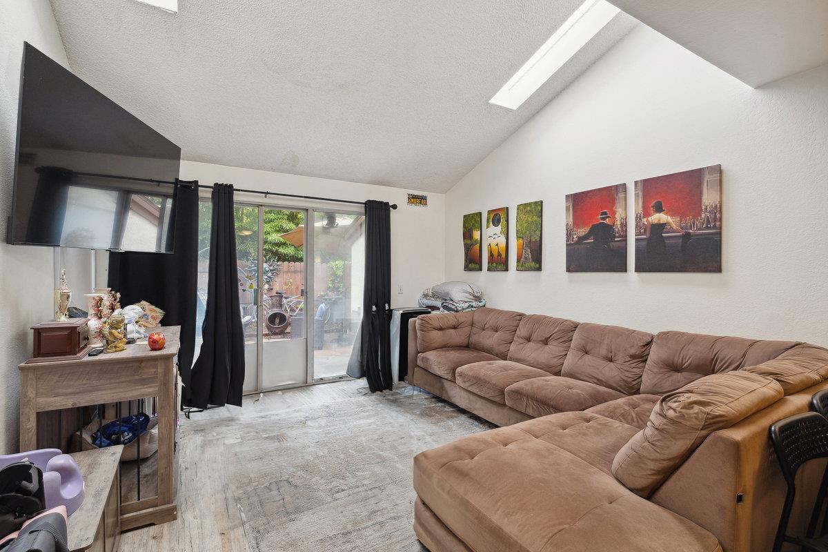415 West Gutierrez Street, Unit 11 Santa Barbara, CA 93101 - Photo 4 of 16 a living room with furniture and a large window