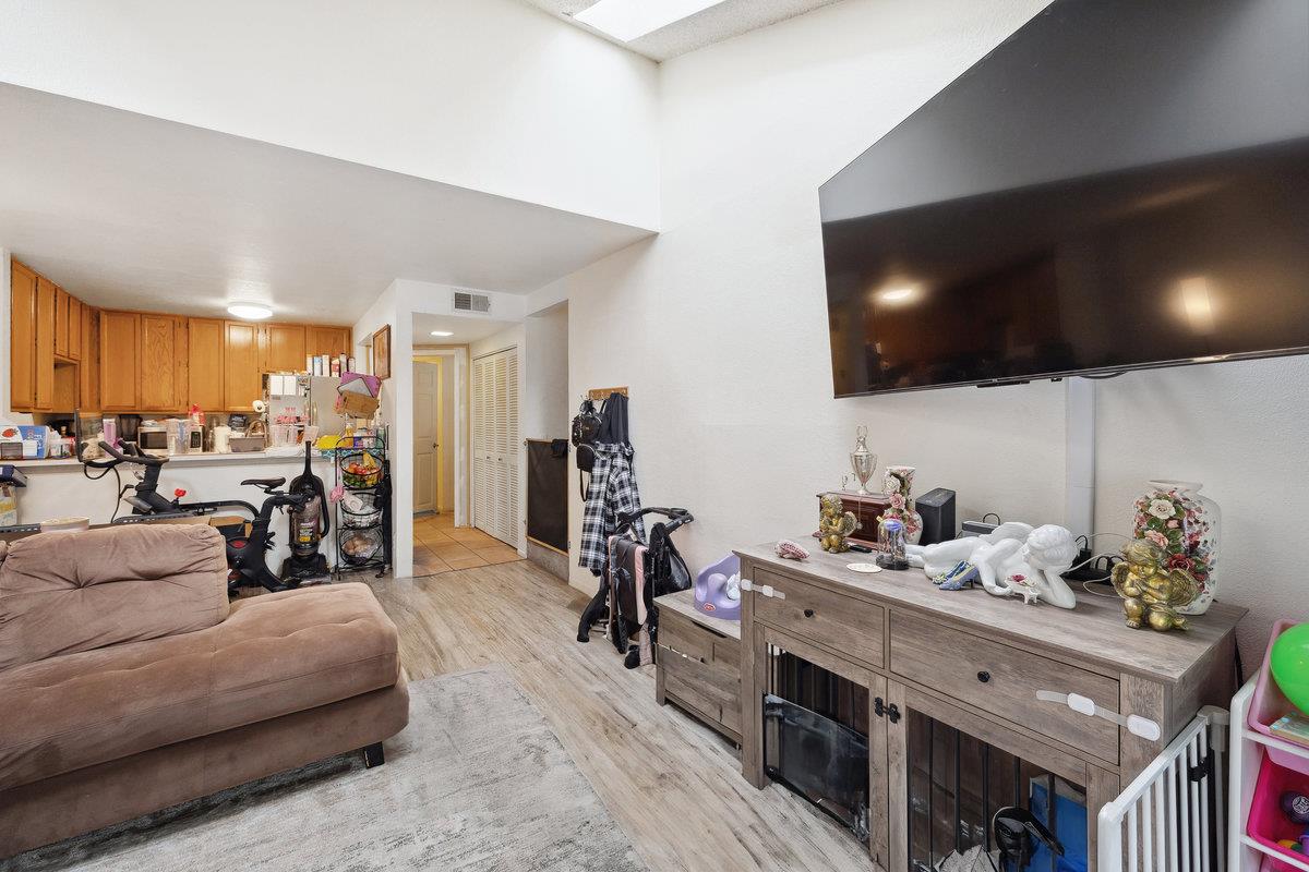 415 West Gutierrez Street, Unit 11 Santa Barbara, CA 93101 - Photo 6 of 16 a living room with furniture kitchen and a flat screen tv