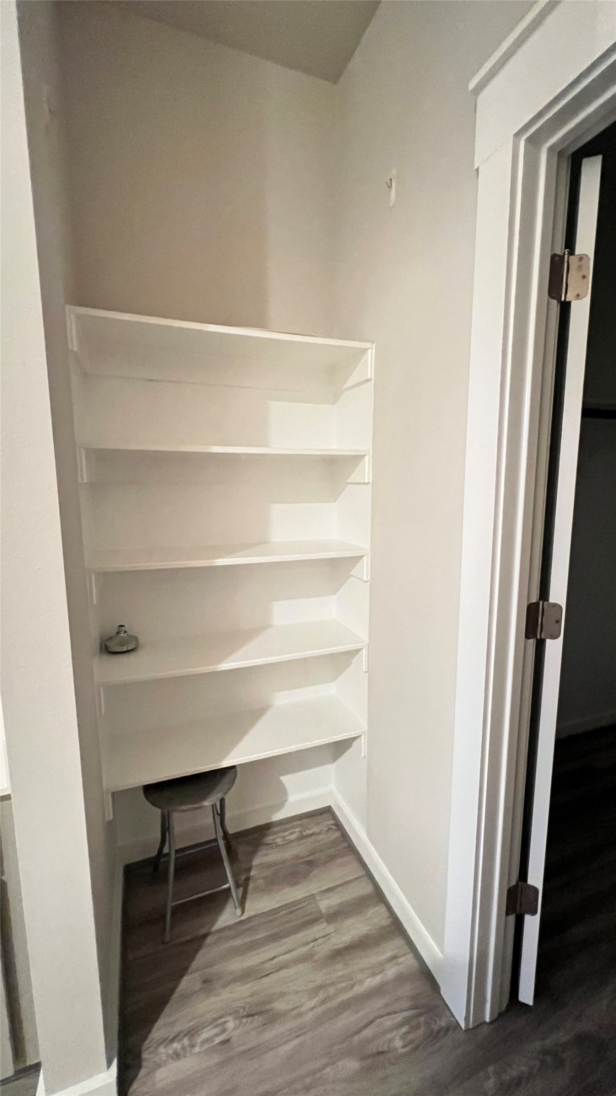 600 D Knopper Street Pflugerville, TX 78660 - Photo 12 of 24 a view of a hallway with wooden floor and a window