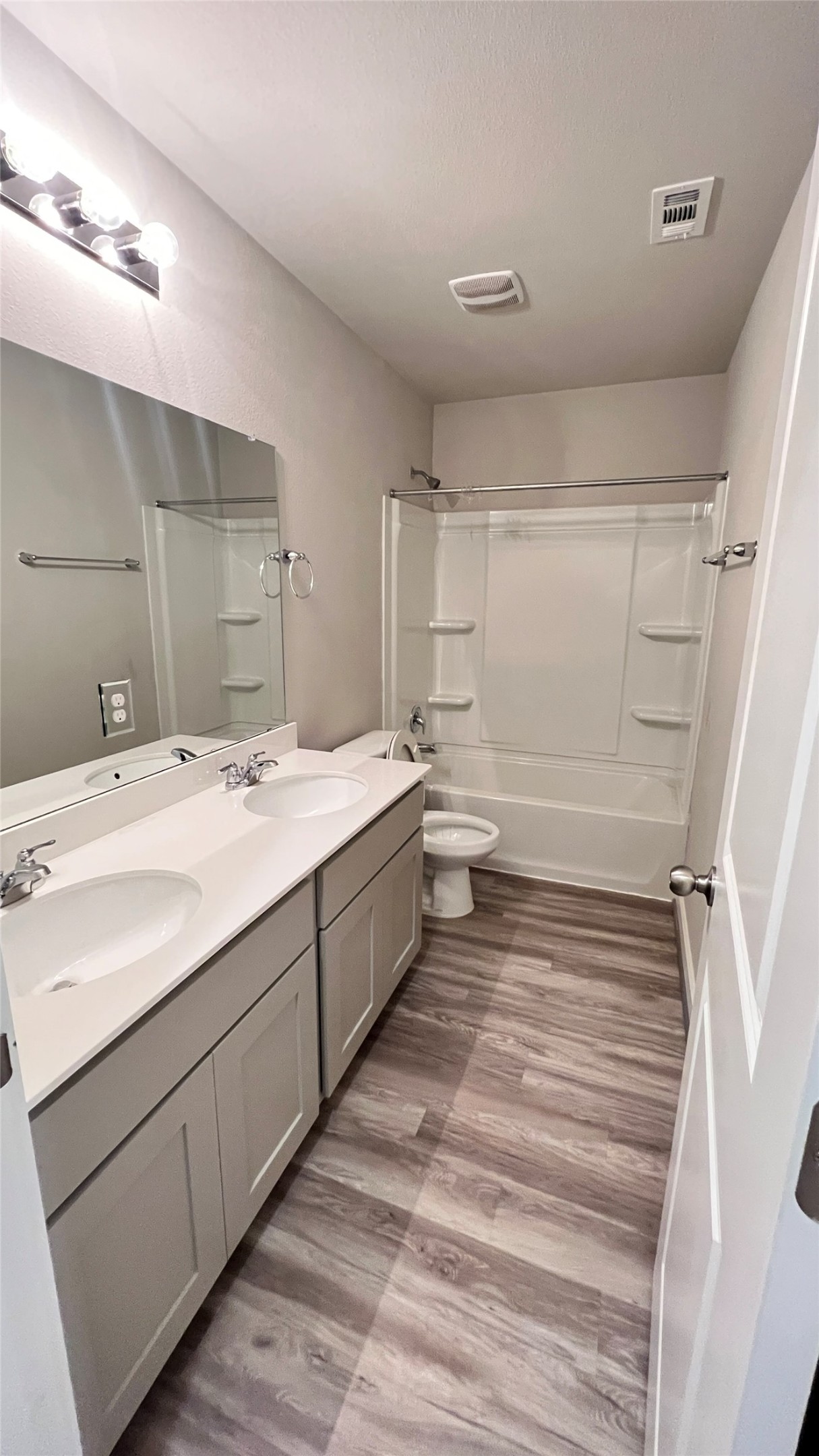 600 D Knopper Street Pflugerville, TX 78660 - Photo 14 of 24 a bathroom with a sink and a mirror