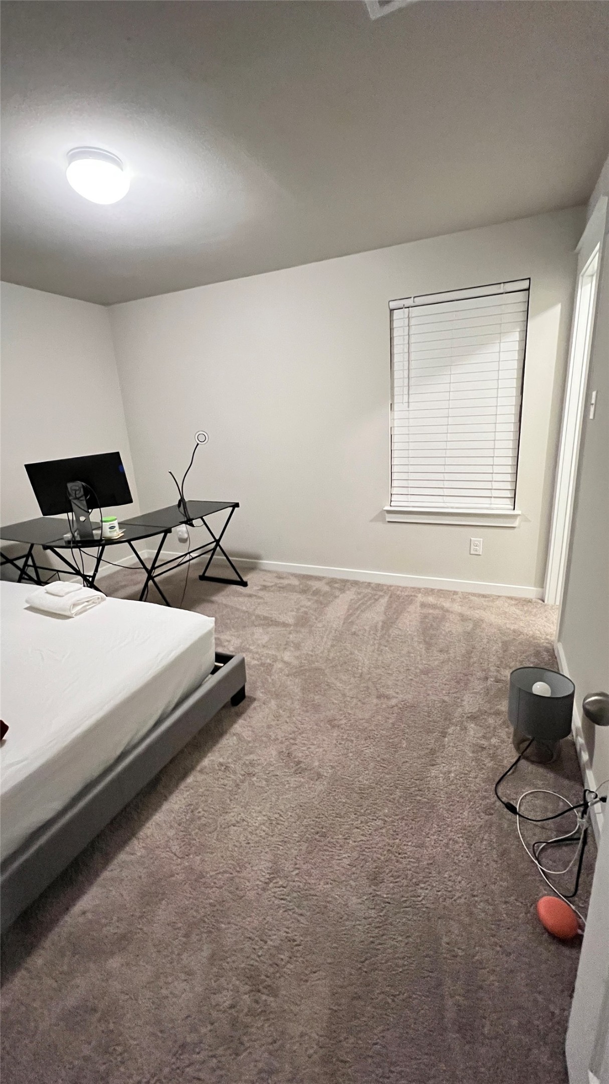 600 D Knopper Street Pflugerville, TX 78660 - Photo 18 of 24 a view of a room with rack and wooden floor