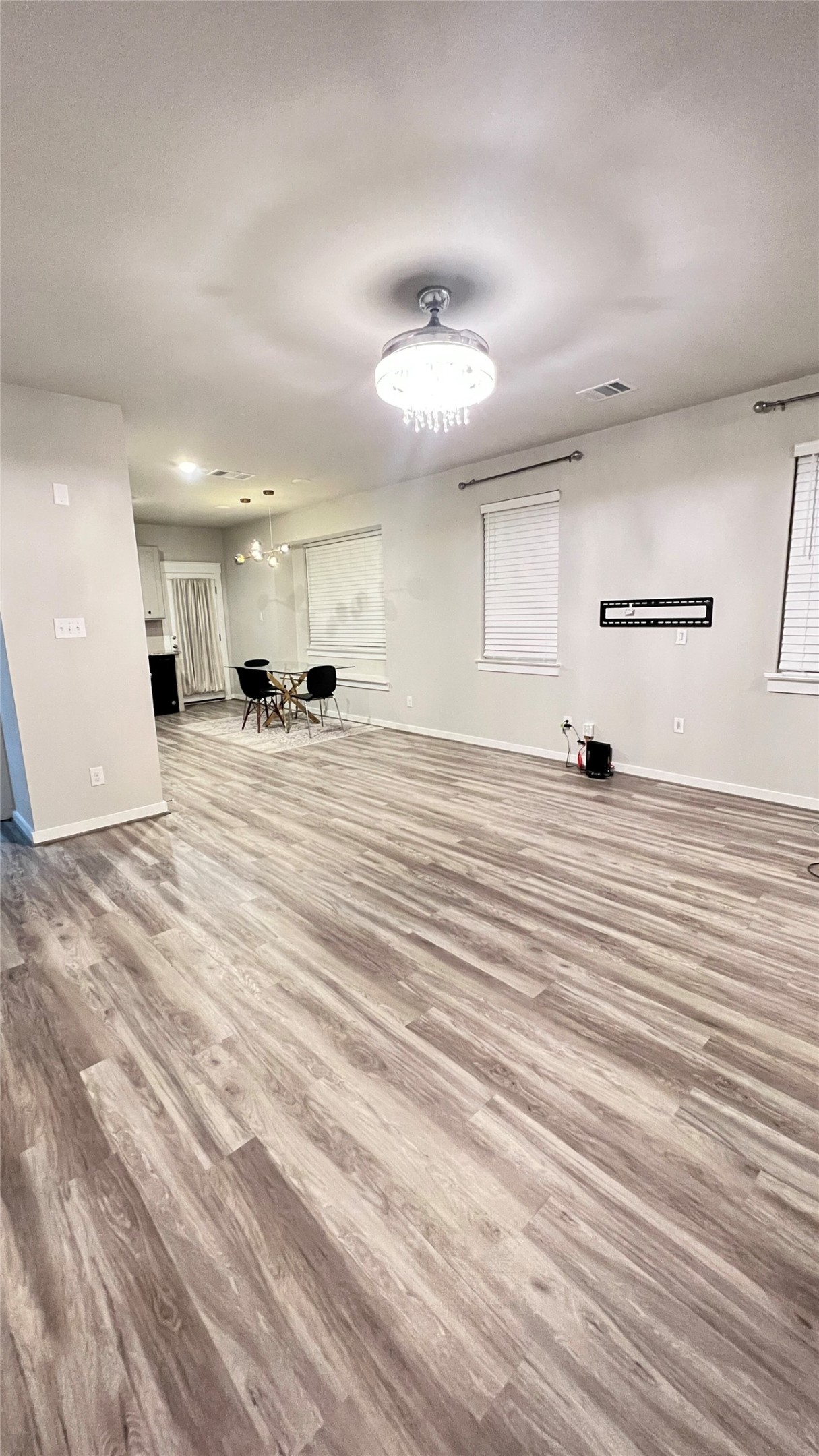 600 D Knopper Street Pflugerville, TX 78660 - Photo 2 of 24 a view of a kitchen with kitchen island white cabinets and stainless steel appliances