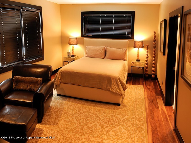 180 Riverside Drive Basalt, CO 81621 - Photo 14 of 14 a bedroom with a bed and a couch