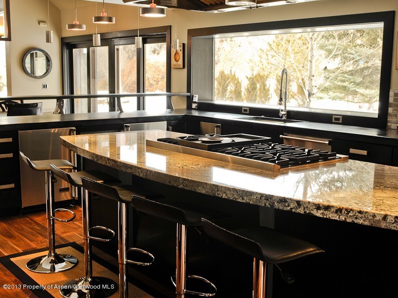 180 Riverside Drive Basalt, CO 81621 - Photo 6 of 14 a kitchen with granite countertop a stove and a sink