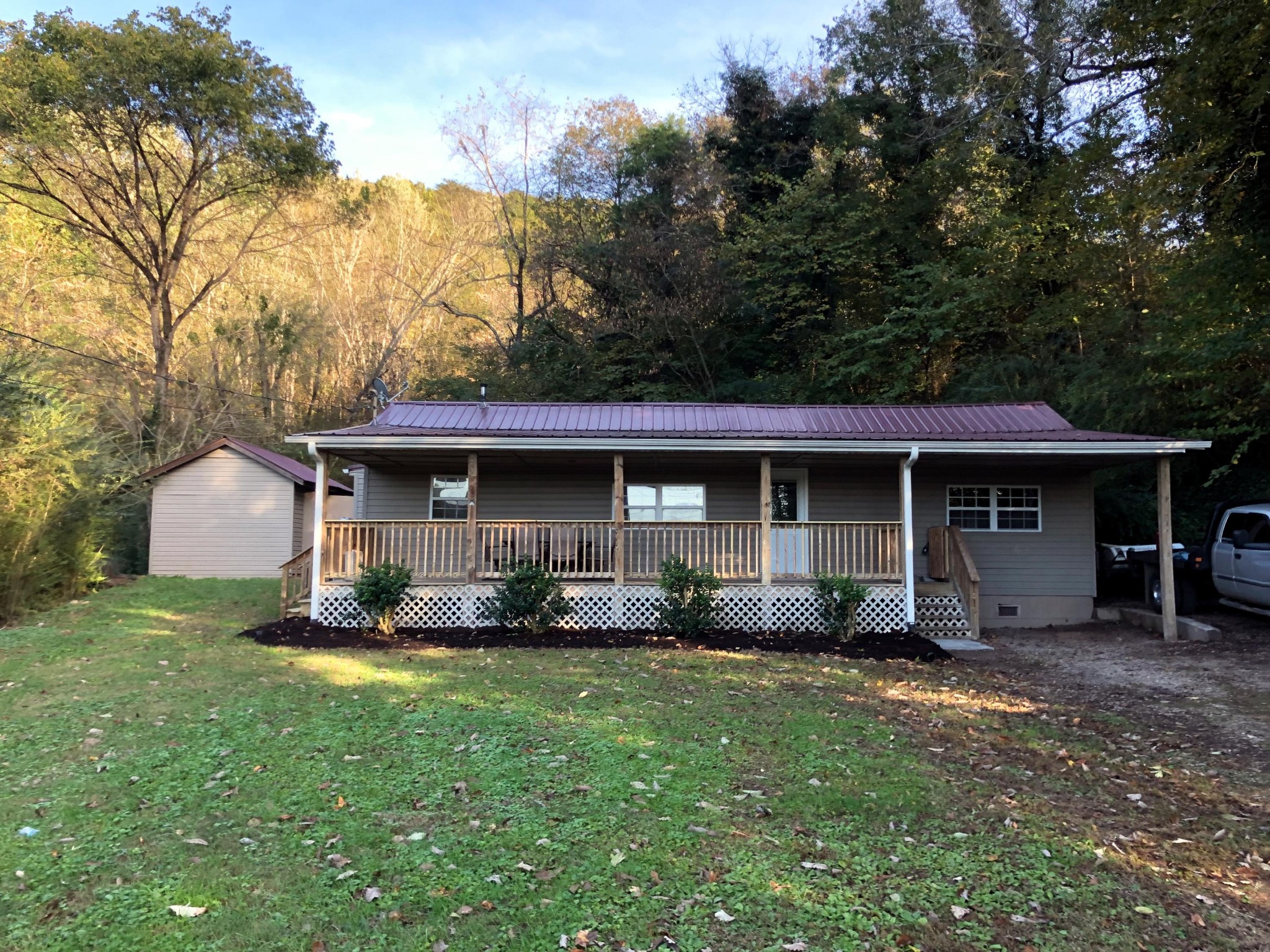 304 Lee Road Clinton, TN 37716 - Photo 1 of 21 a front view of a house with a yard and trees