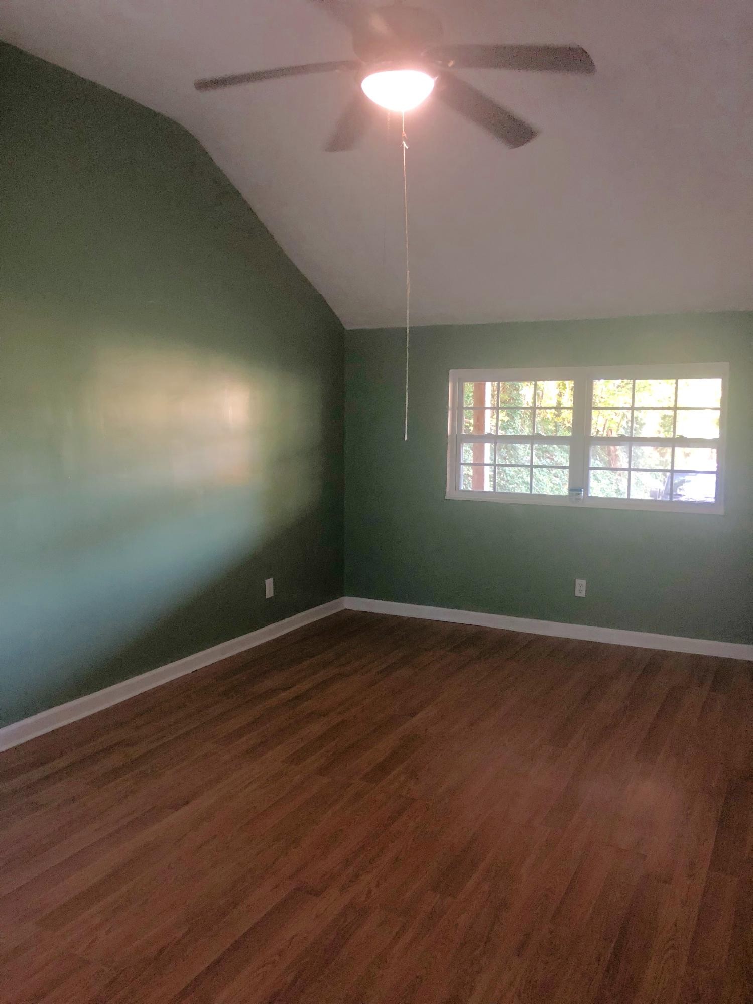 304 Lee Road Clinton, TN 37716 - Photo 14 of 21 an empty room with wooden floor and windows
