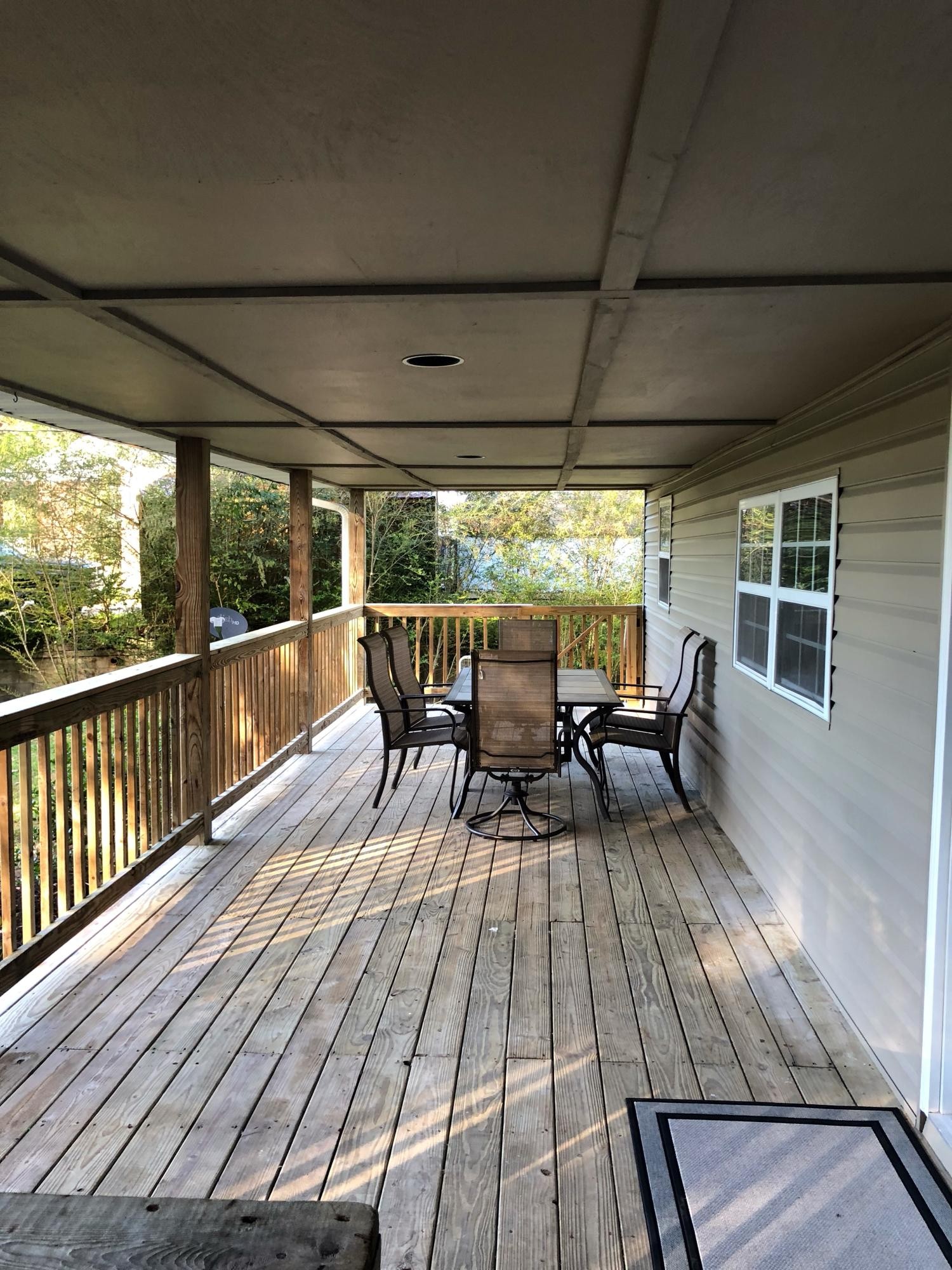 304 Lee Road Clinton, TN 37716 - Photo 3 of 21 a view of a chairs and table in patio with wooden floor